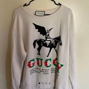 I’m selling a Medium Gucci “Guccy” sweater with a pegasus
